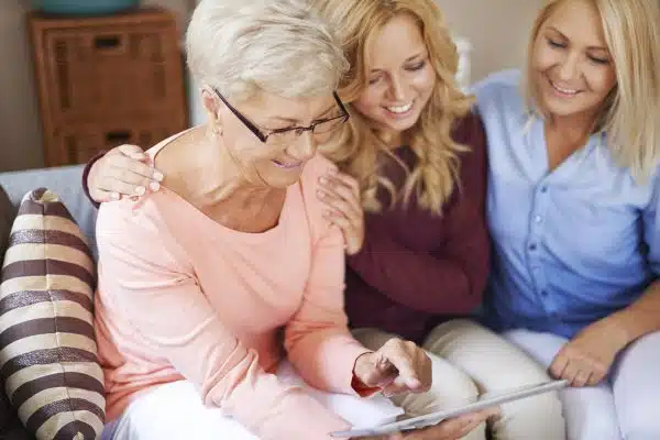 Women sitting on couch learning about their genetics