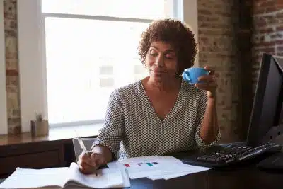 Mature Business woman Working In Office