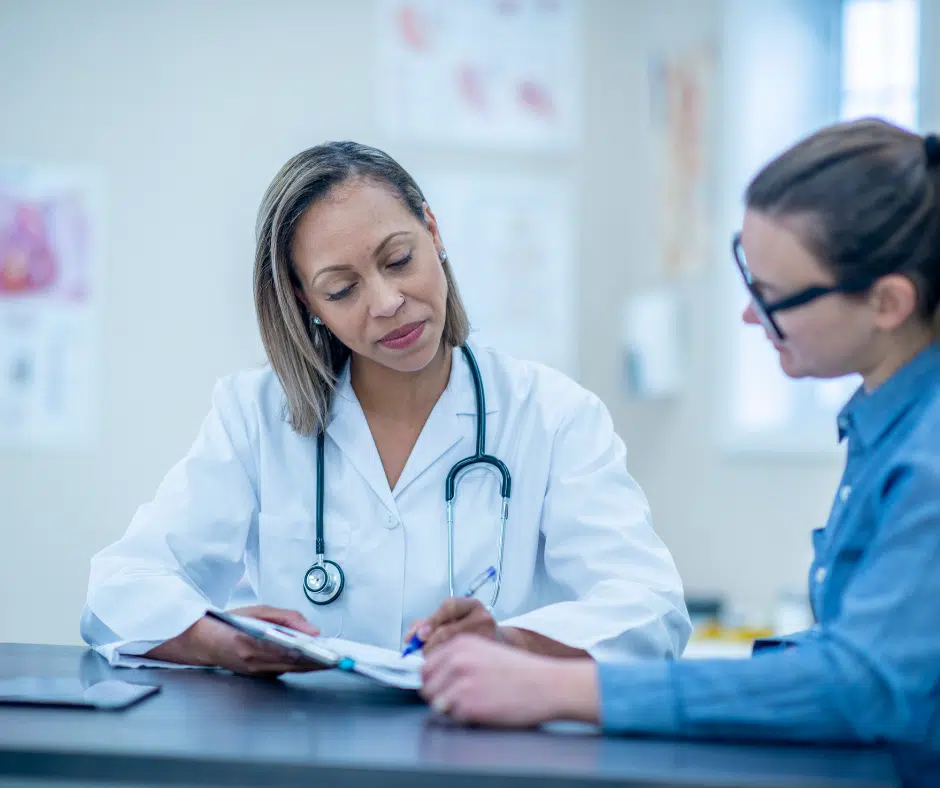 Female patient talking to doctor