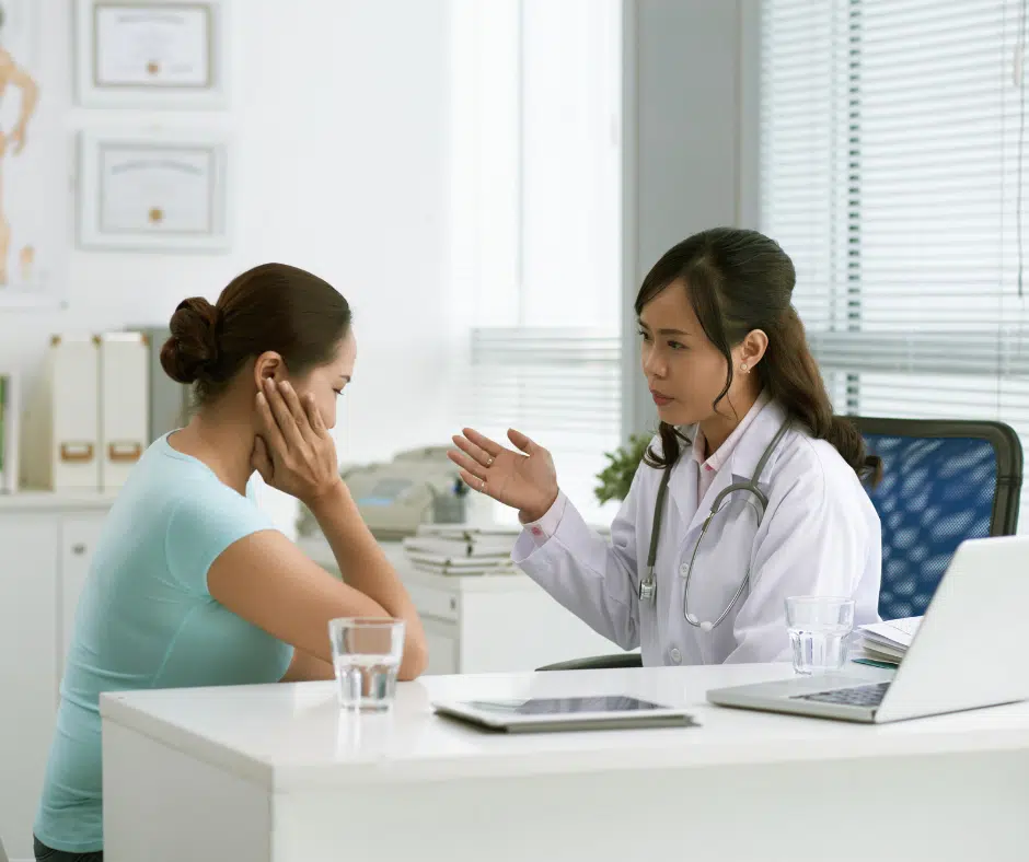 woman talking to female doctor