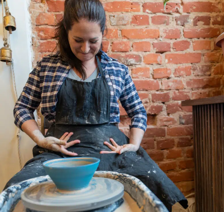 woman at pottery wheel