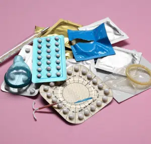 Assortment of birth control options like pills, rings, and injections