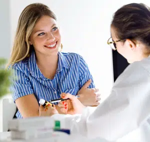 young woman talking to doctor about contraception counseling