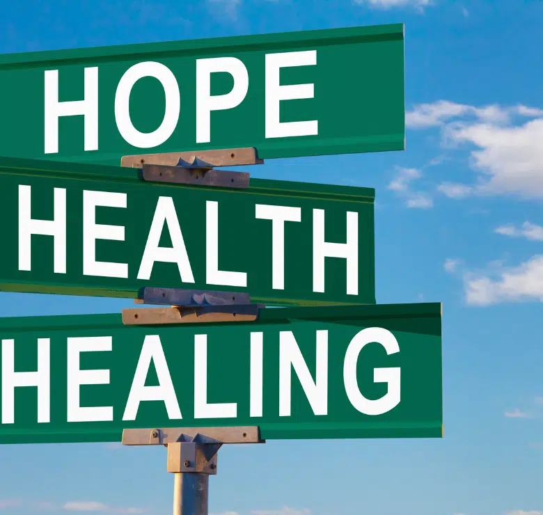 three signs that read 'hope' 'health' and 'healing'