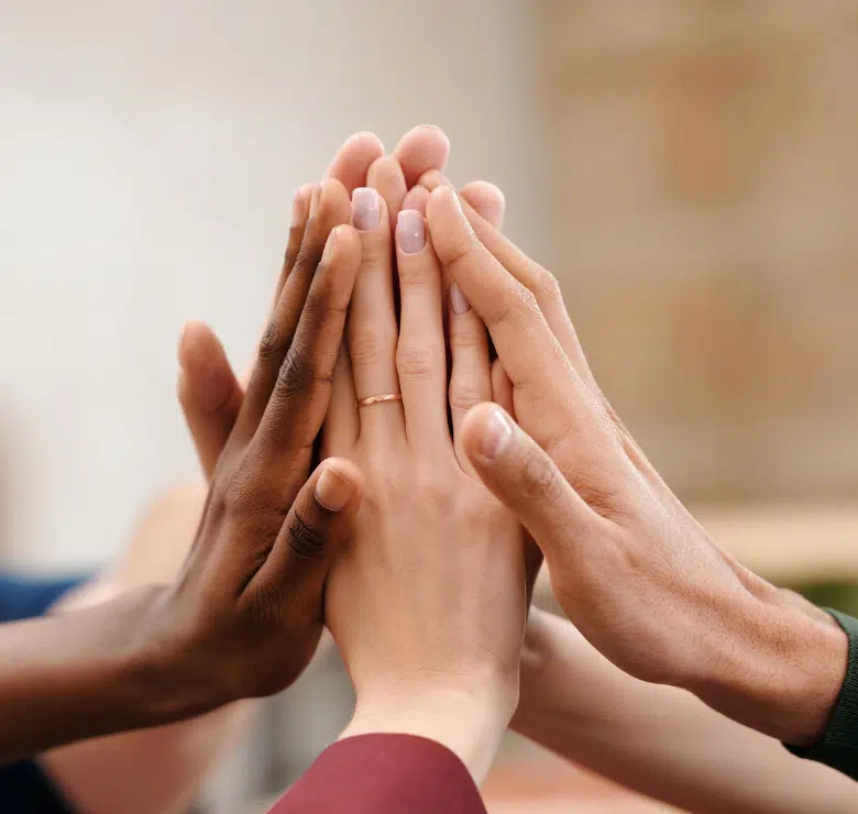 female hands held together in unity